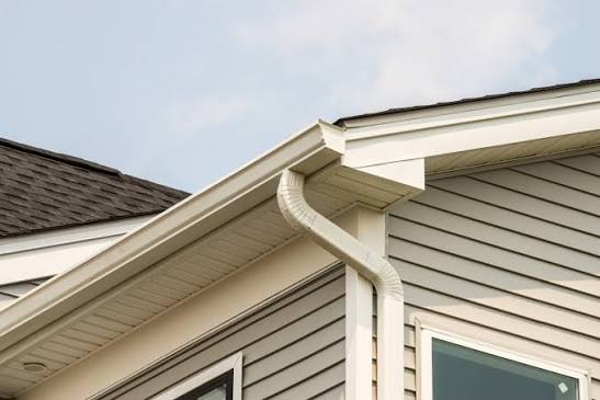 United Roofing & Siding gutter downspout installation with residential siding in Sioux Falls, SD