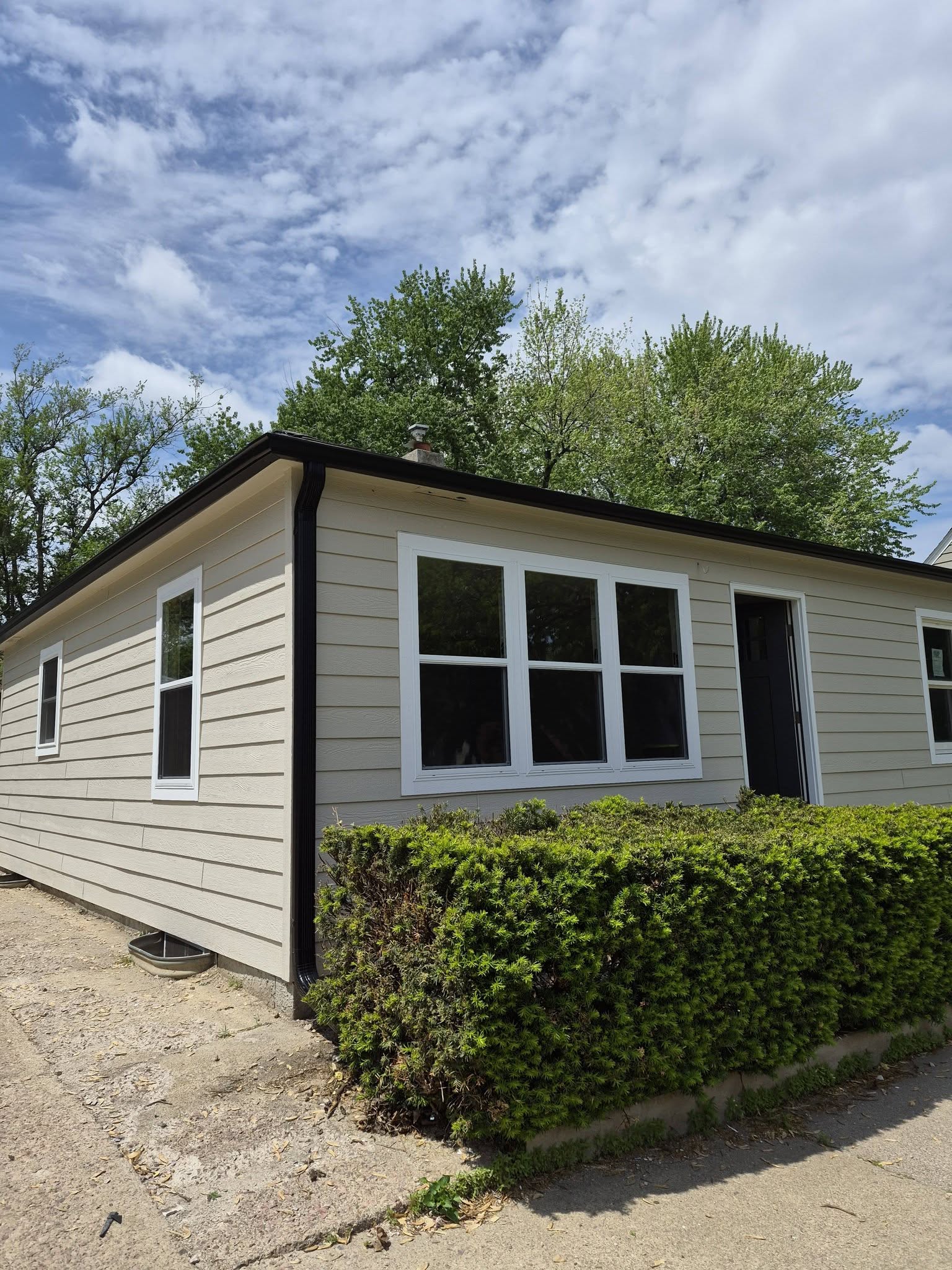 United Roofing & Siding residential siding with black gutter installation for a home exterior in Sioux Falls, SD