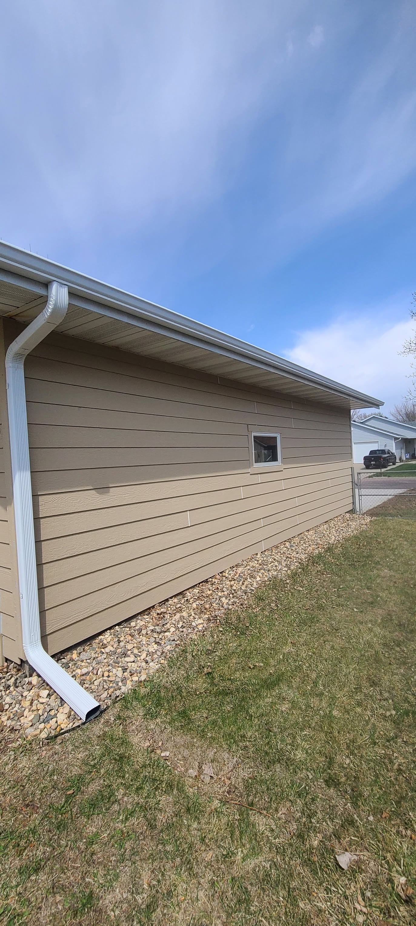 United Roofing & Siding siding and downspout installation for a residential home exterior in Sioux Falls, SD