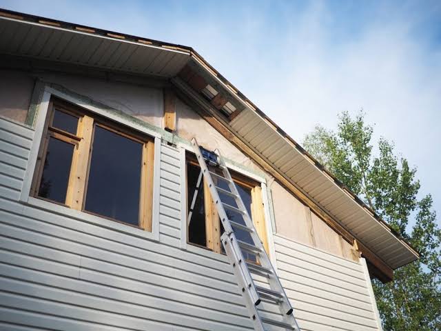 United Roofing & Siding siding repair and installation work on a residential home exterior in Sioux Falls, SD